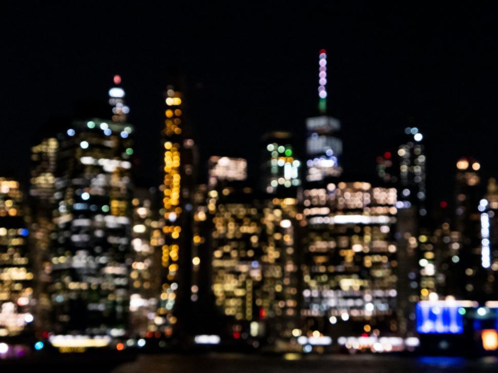 Free Image of Blurred cityscape with colorful bokeh lights 