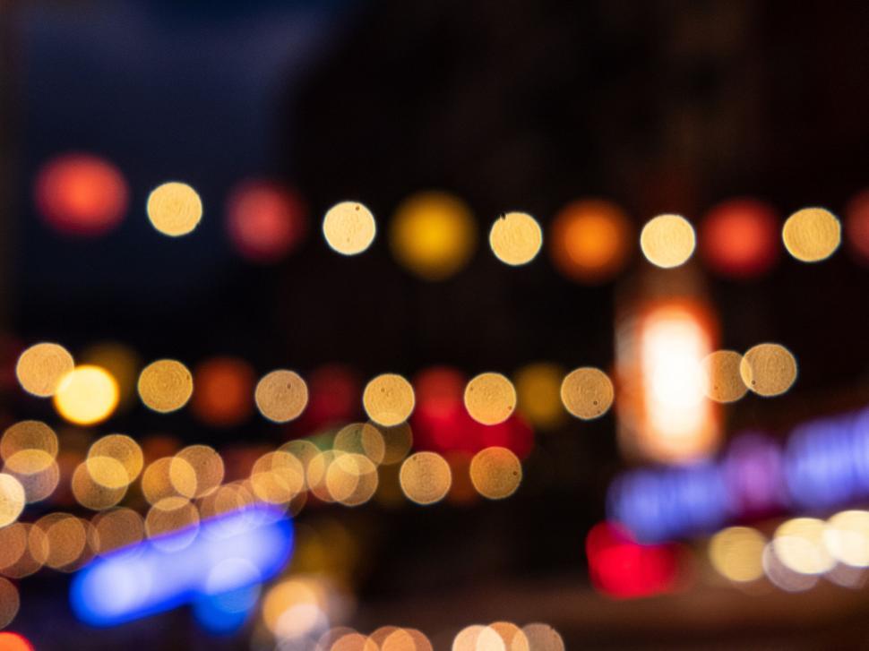 Free Image of City lights blurred into colorful bokeh effect 