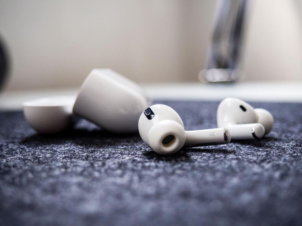 Free Image of Close-up of wireless earbuds on fabric 
