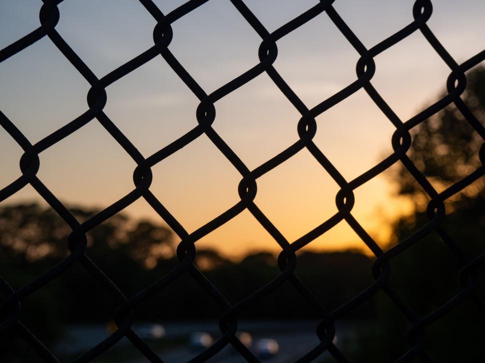 Free Image of Fence silhouette during sunset 