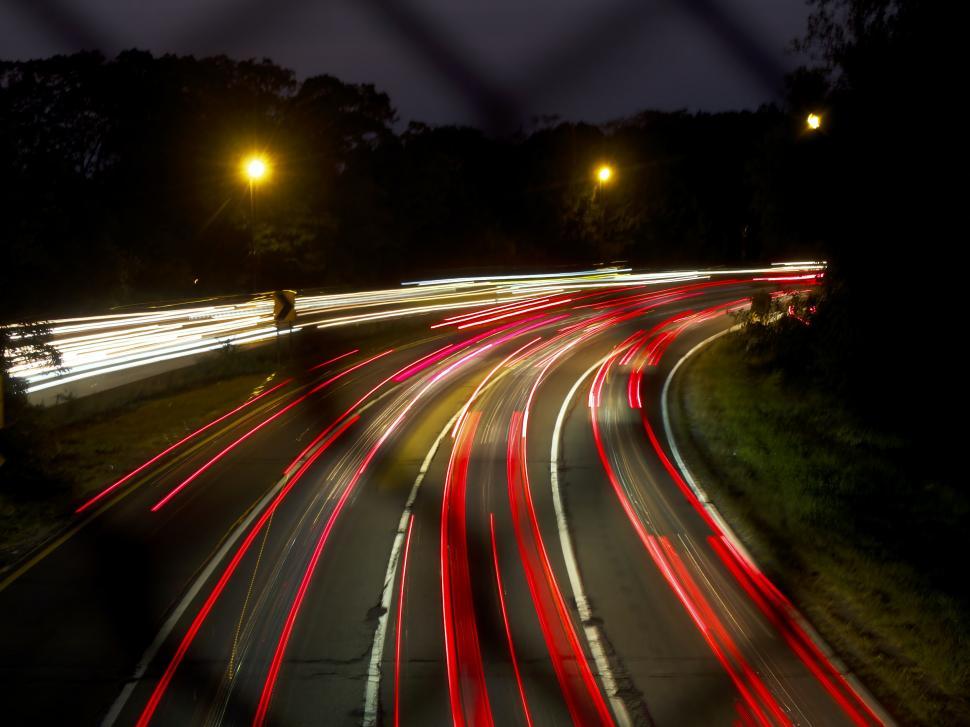 Free Image of Long exposure of highway traffic at night 