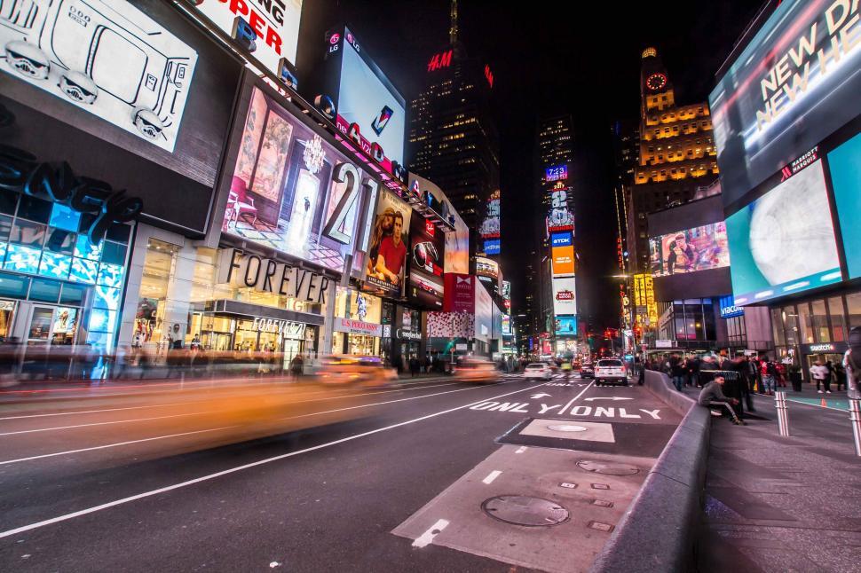 Free Image of Vivid Times Square at night with motion blur 