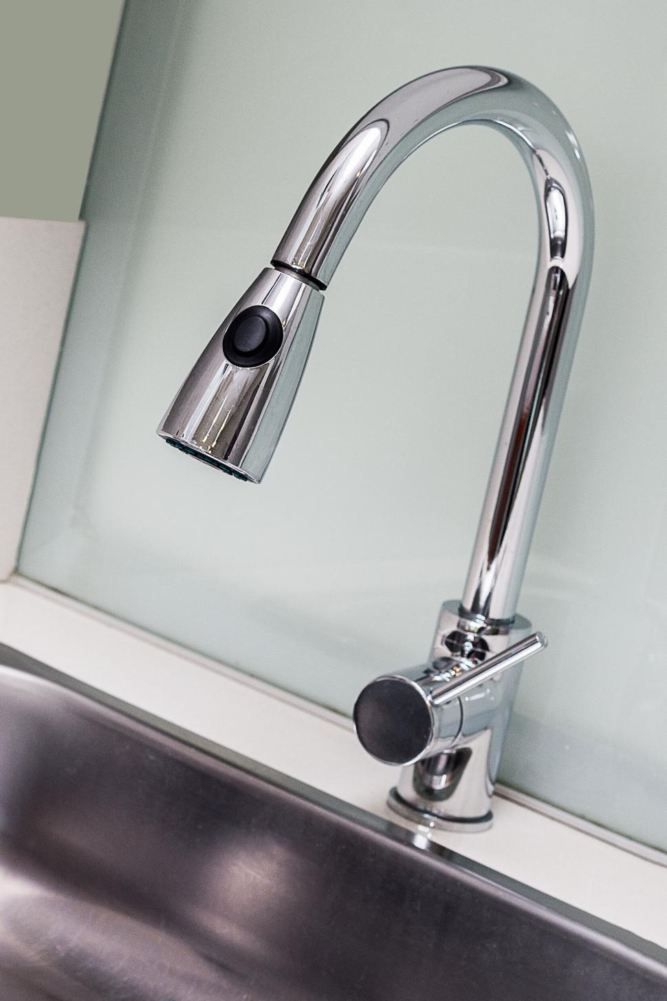 Free Image of Modern kitchen faucet over stainless steel sink 