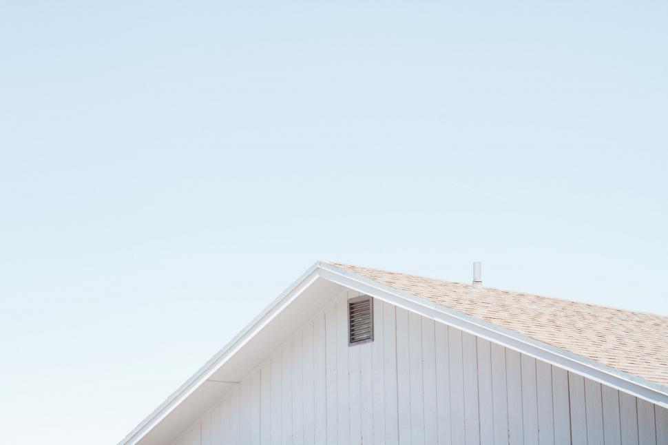 Free Image of Minimalistic white house gable under blue sky 