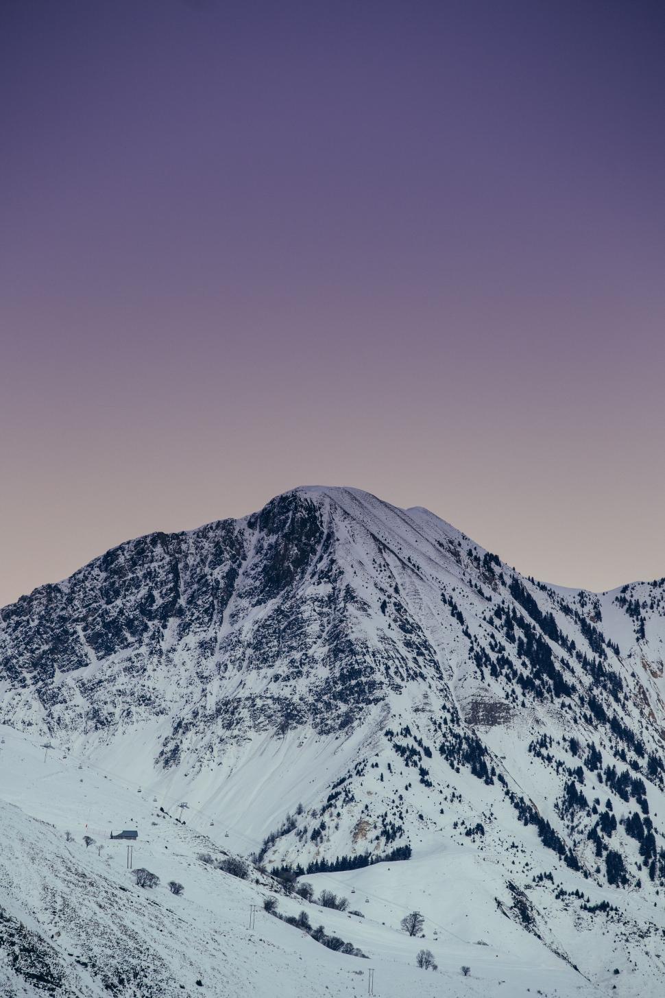Free Image of Twilight over a solitary mountain peak 