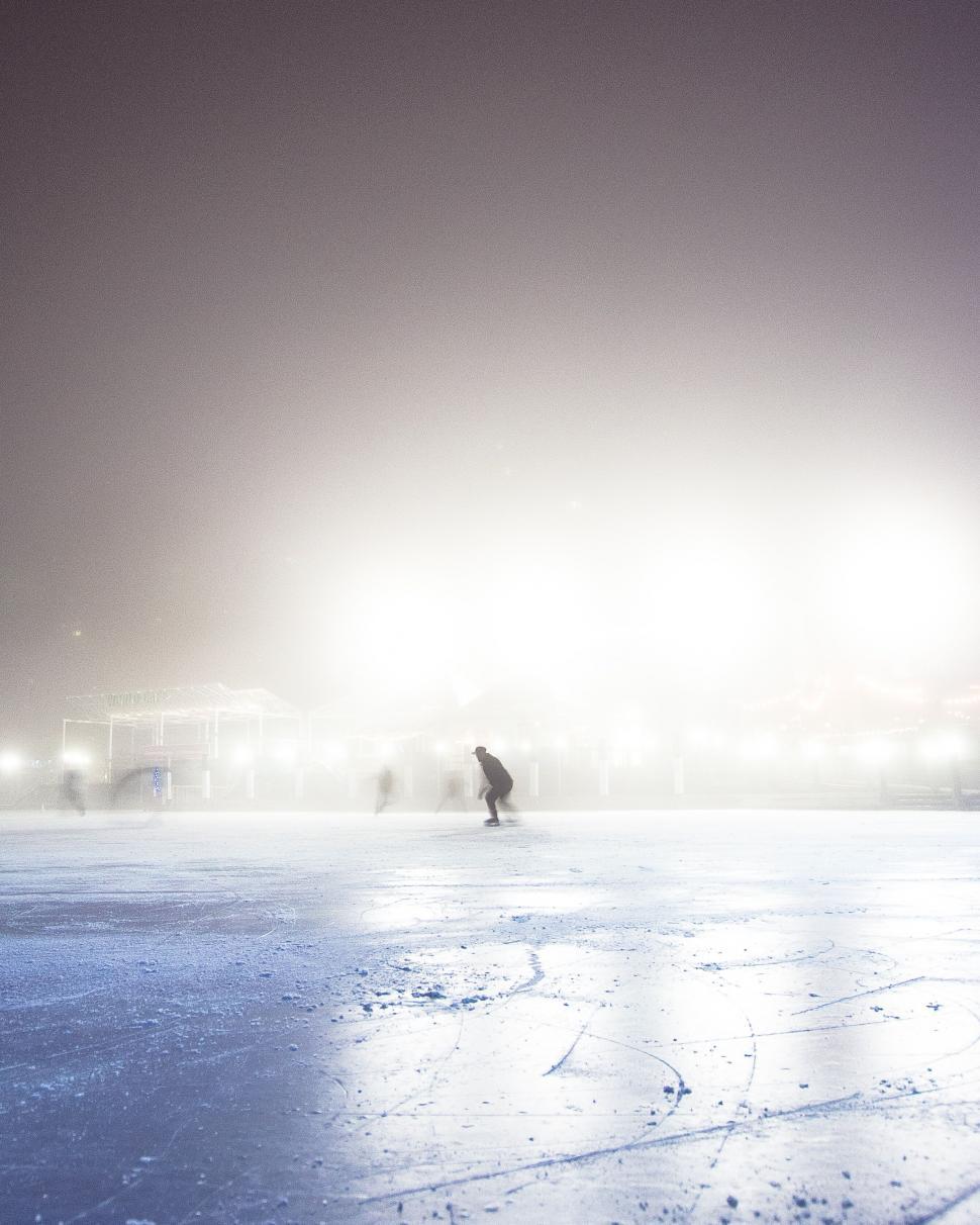 Free Image of Silhouette in foggy urban ice rink 