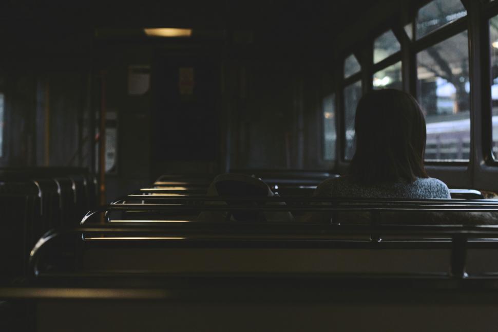 Free Image of Lonely woman riding in an empty bus 
