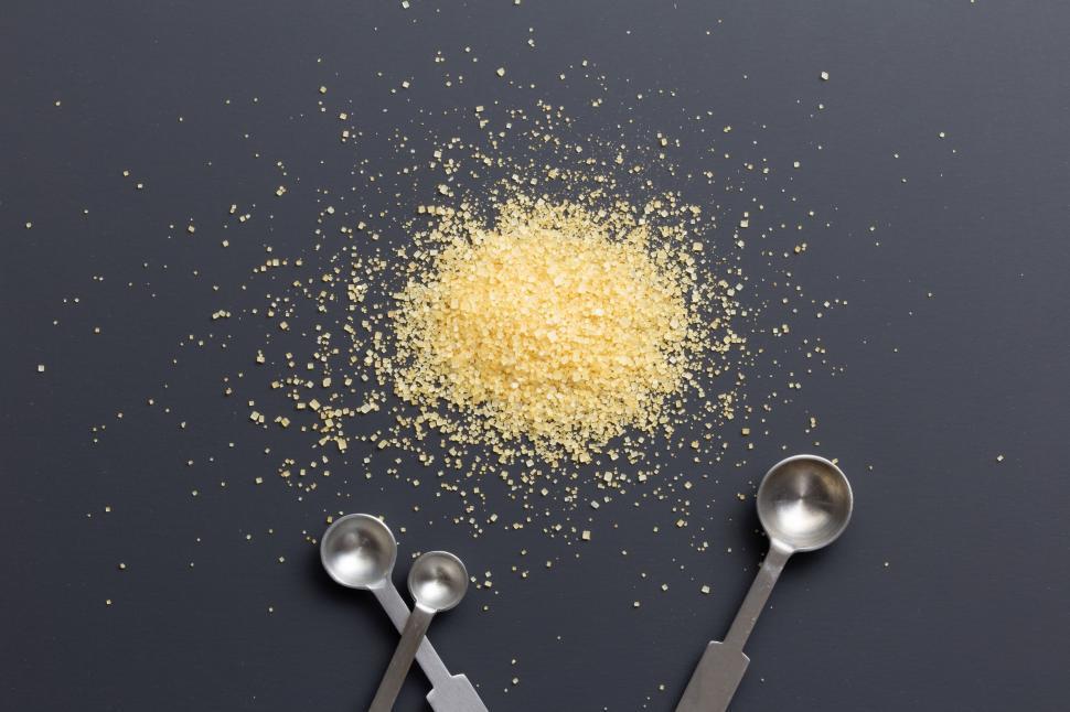 Free Image of Heap of granulated sugar with metal spoons 