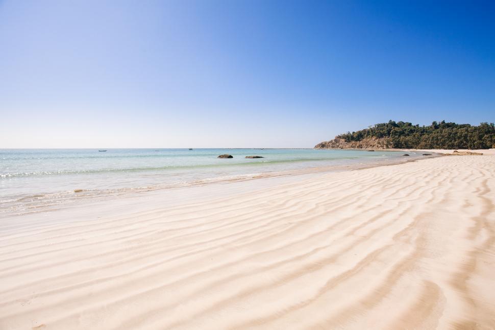 Free Image of Tranquil beach with rippled sand 