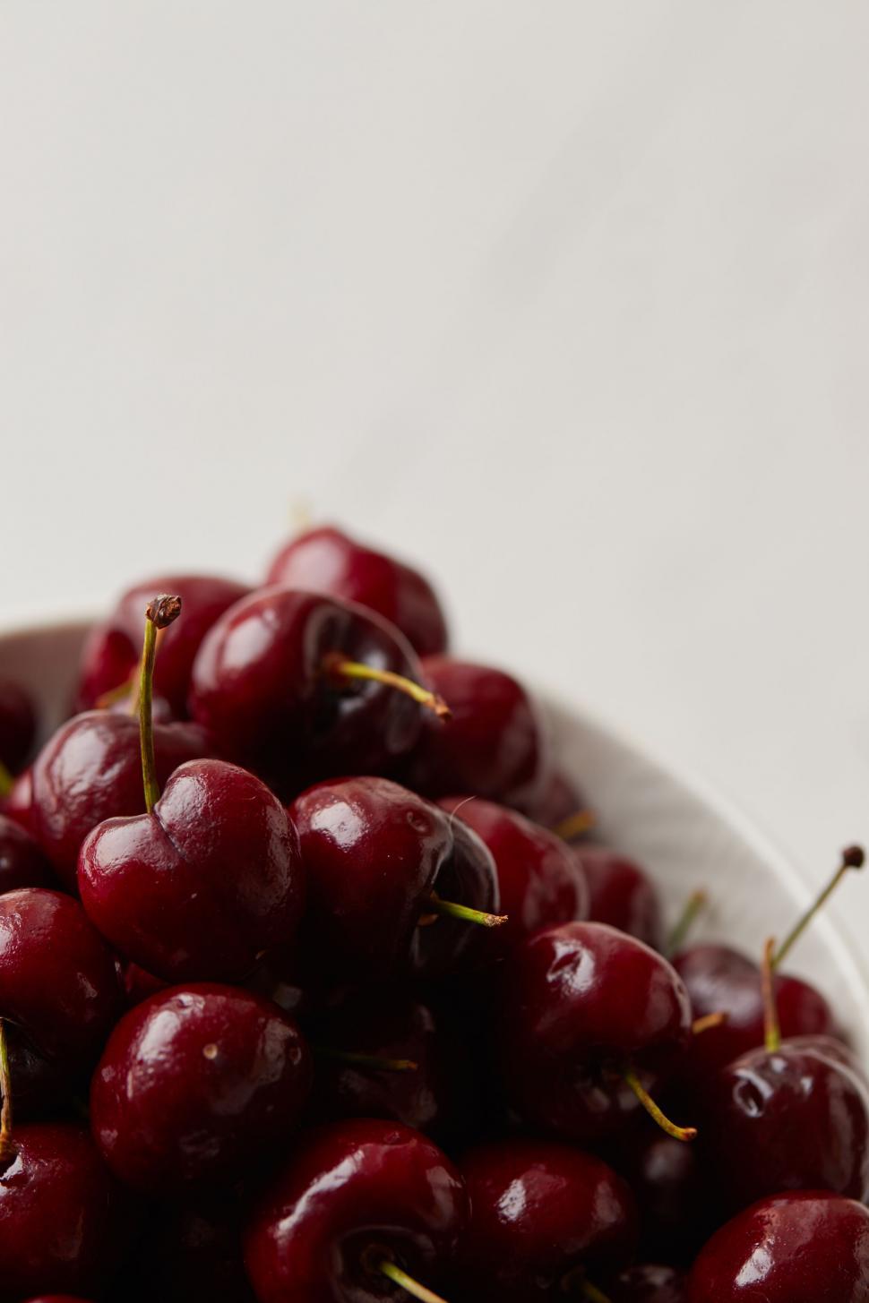 Free Image of Bowl of cherries on a white background 