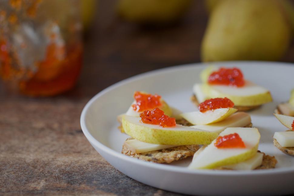 Free Image of Pear and jam on crackers snack plate 
