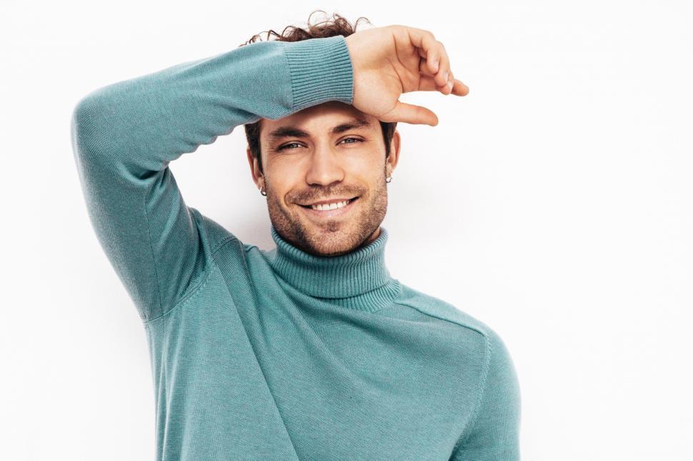 Free Image of A man in a blue sweater 