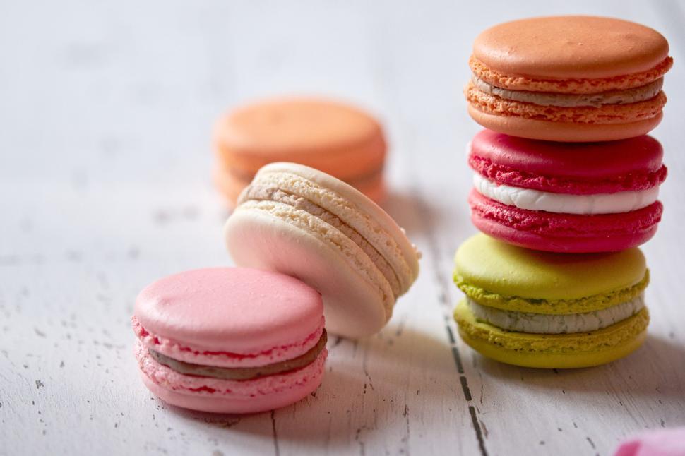 Free Image of Stacked colorful macarons on a white background 