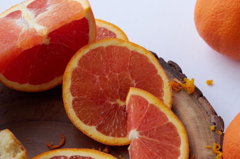 Free Image of Grapefruit slices on a wooden board 