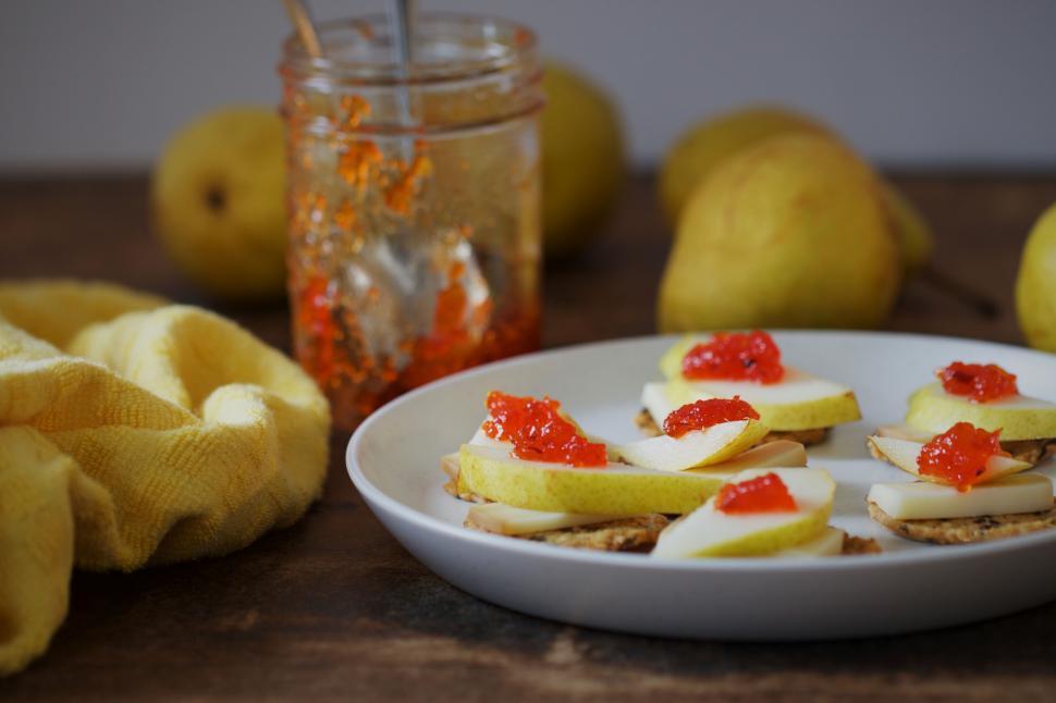 Free Image of Pears and cheese crackers with jam on plate 