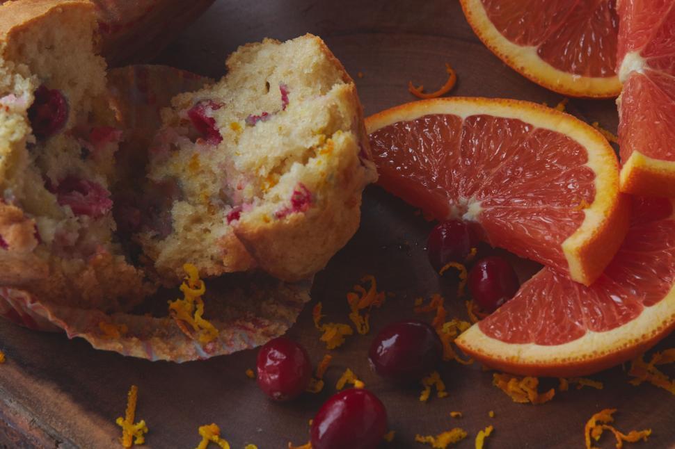 Free Image of Pink grapefruit muffin with scattered fruit 