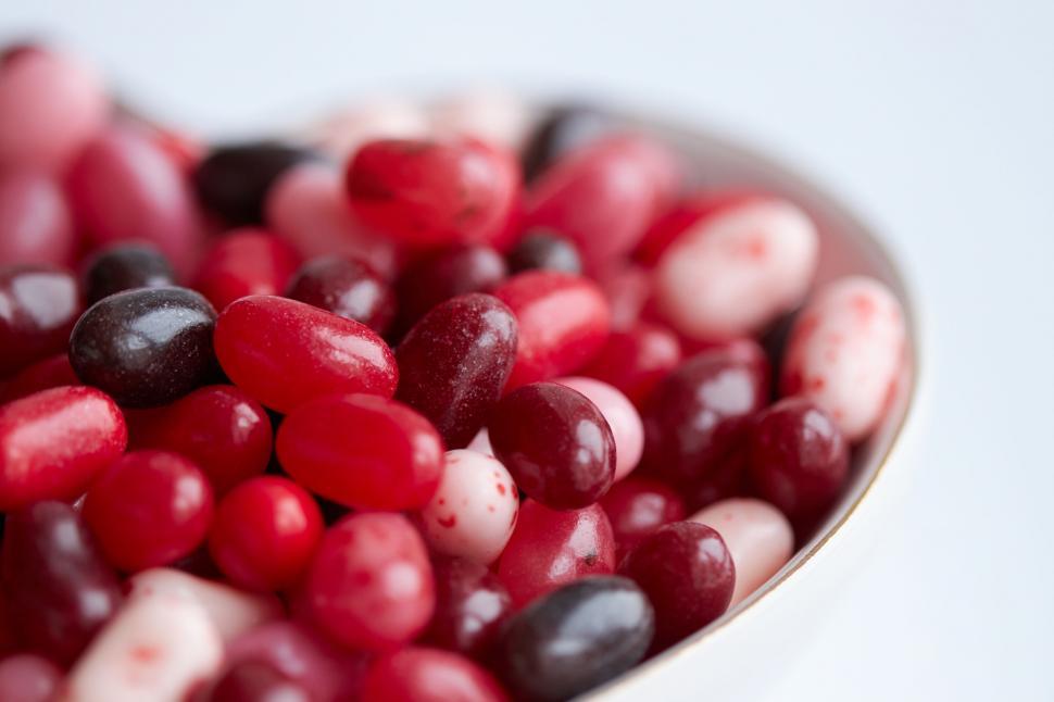Free Image of Bowl of assorted jelly beans blurred face 
