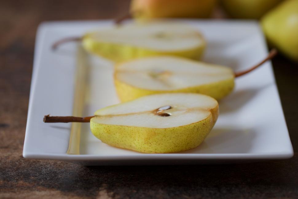 Free Image of Sliced pear on a white plate 