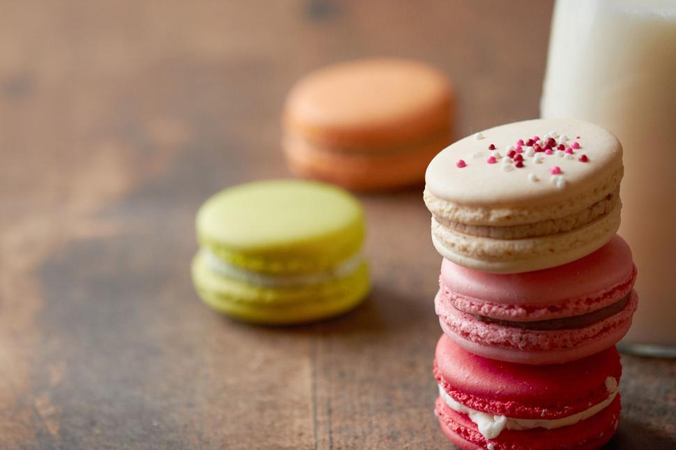 Free Image of Stack of colorful macarons with milk 