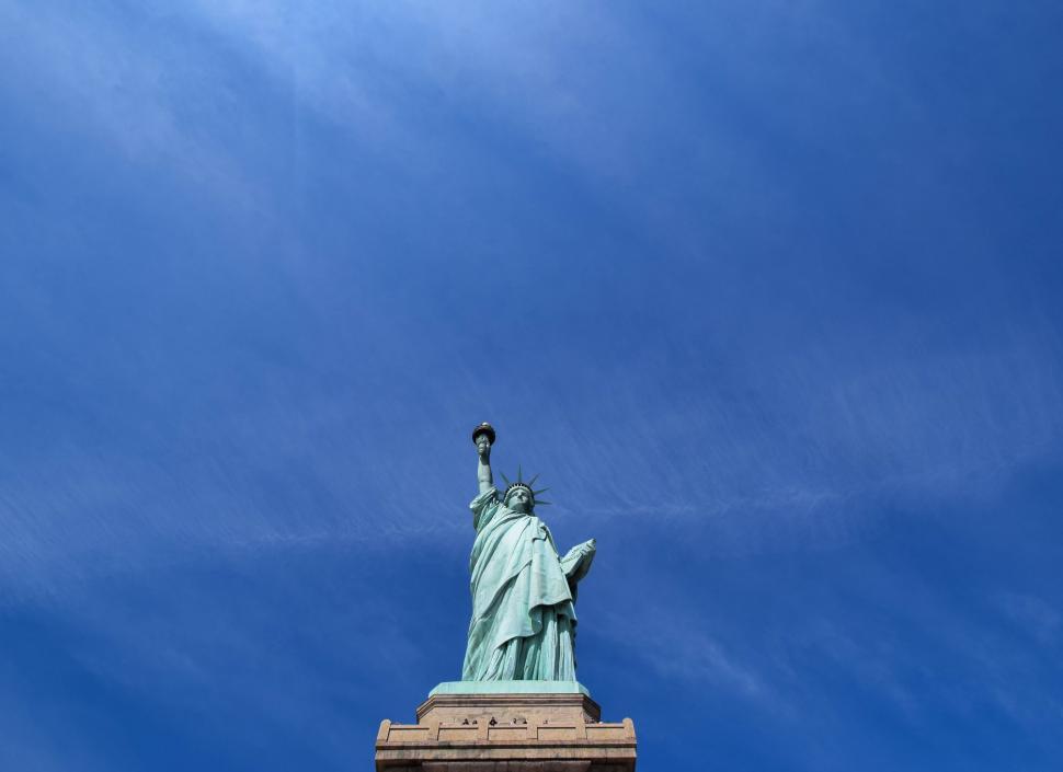 Free Image of Statue of Liberty against a clear blue sky 