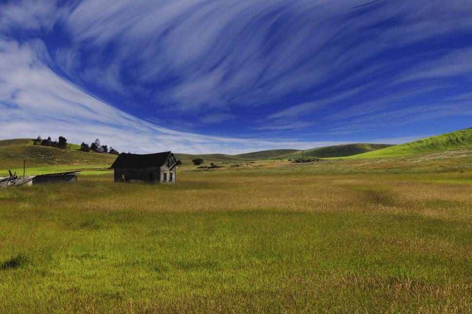 Free Image of Abandoned house in a sweeping grassland 