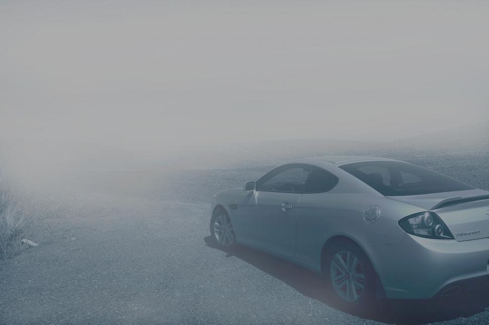 Free Image of Car in misty desolate landscape 