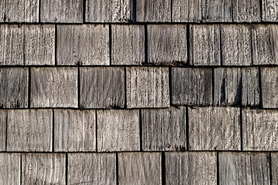 Free Image of Weathered wooden shingle texture close-up 
