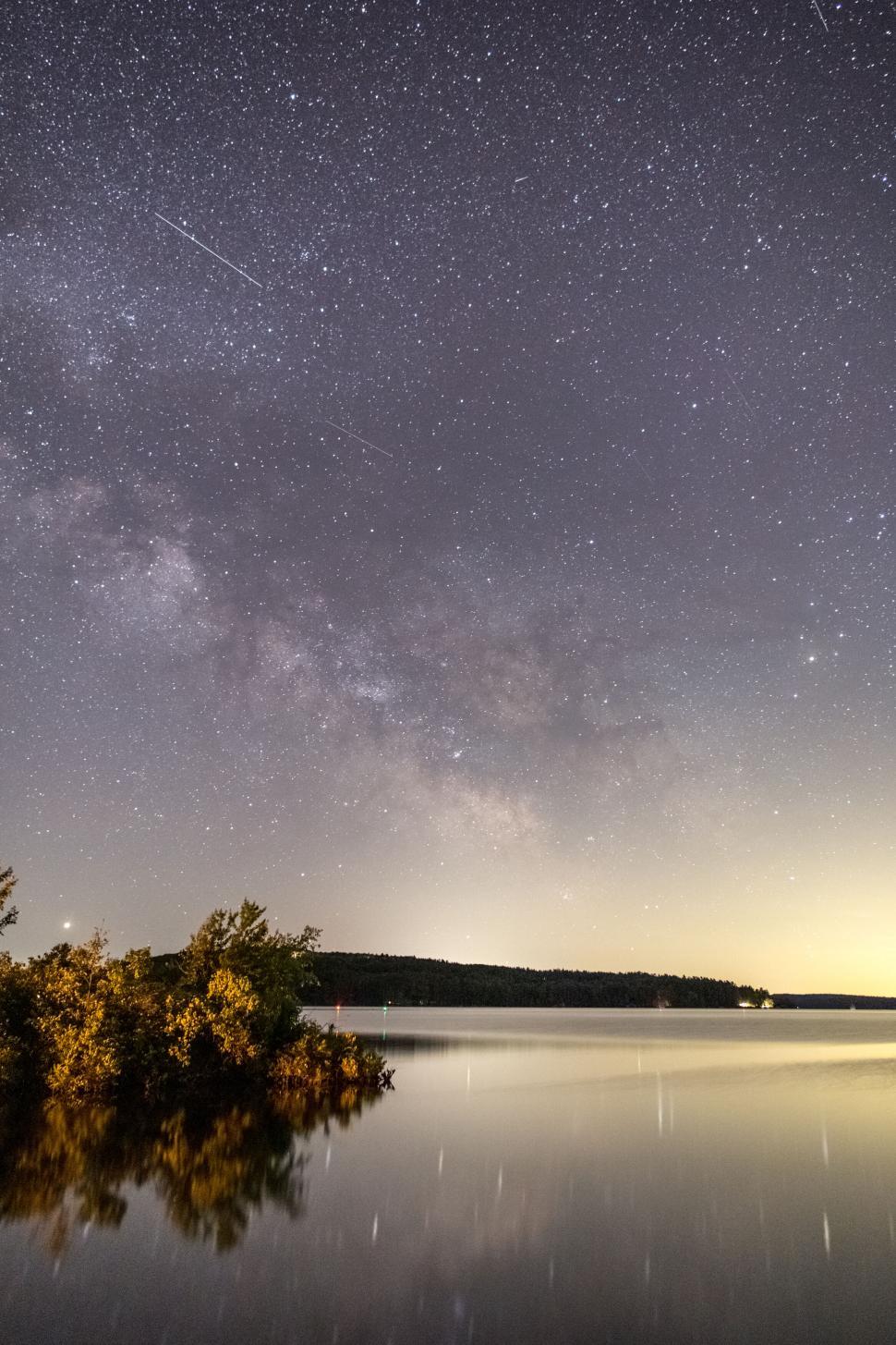 Free Image of Milky Way over a serene lake landscape 