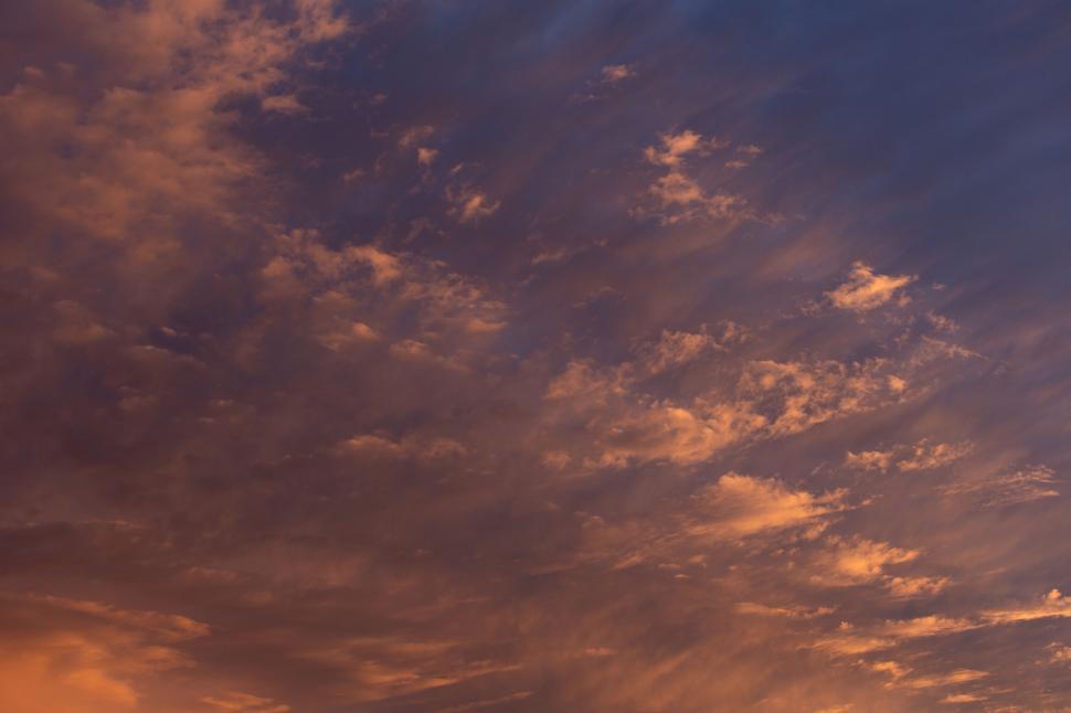 Free Image of Dramatic cloudy sky with orange tones 