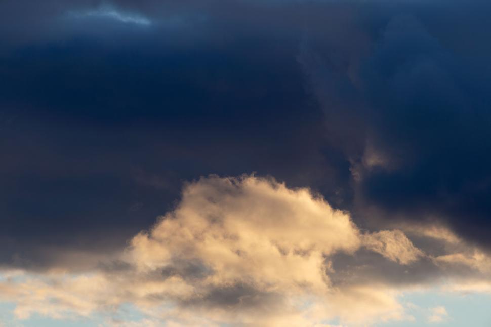 Free Image of Golden cloud highlighted by the sunset 