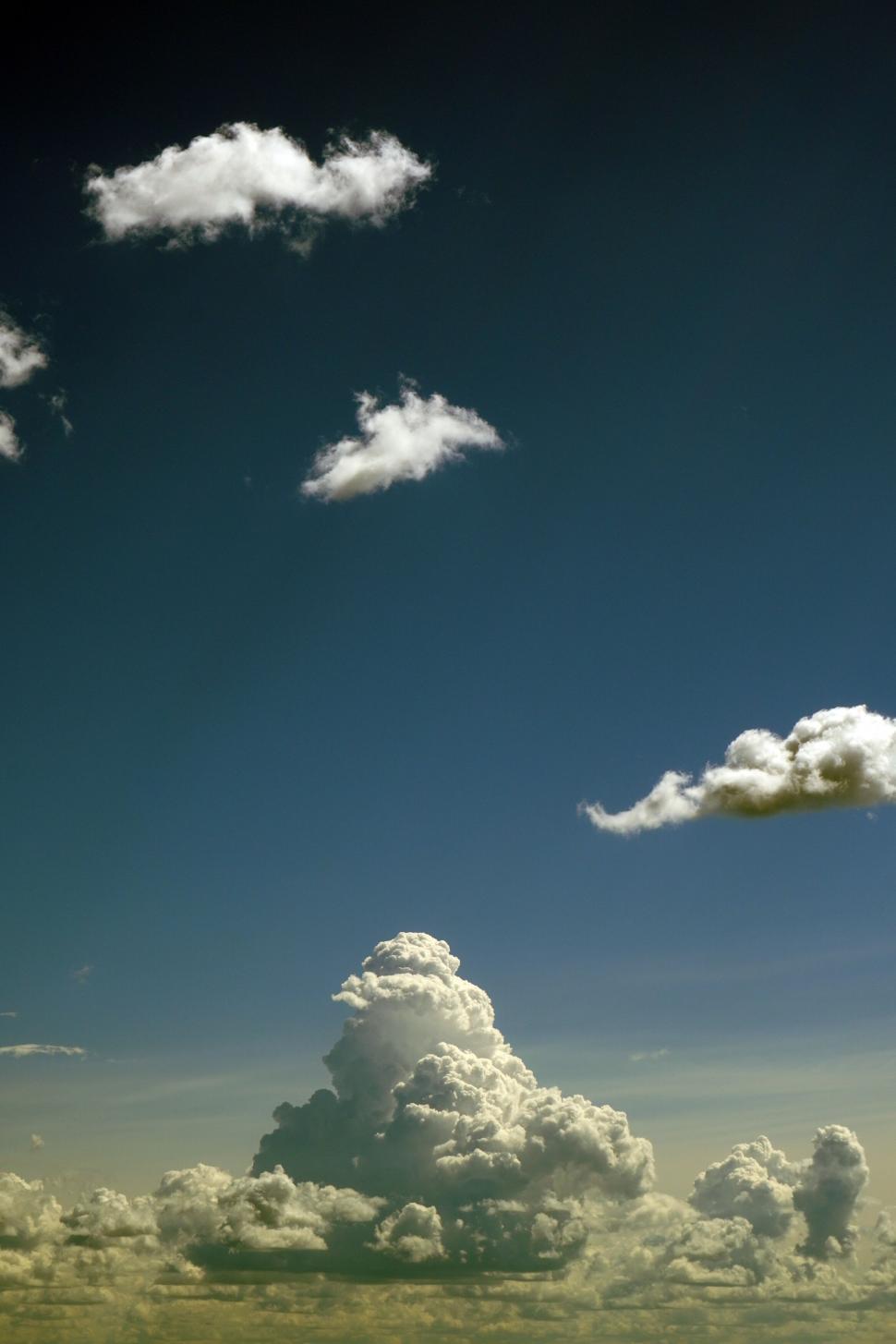 Free Image of Majestic cumulus clouds in a clear blue sky 