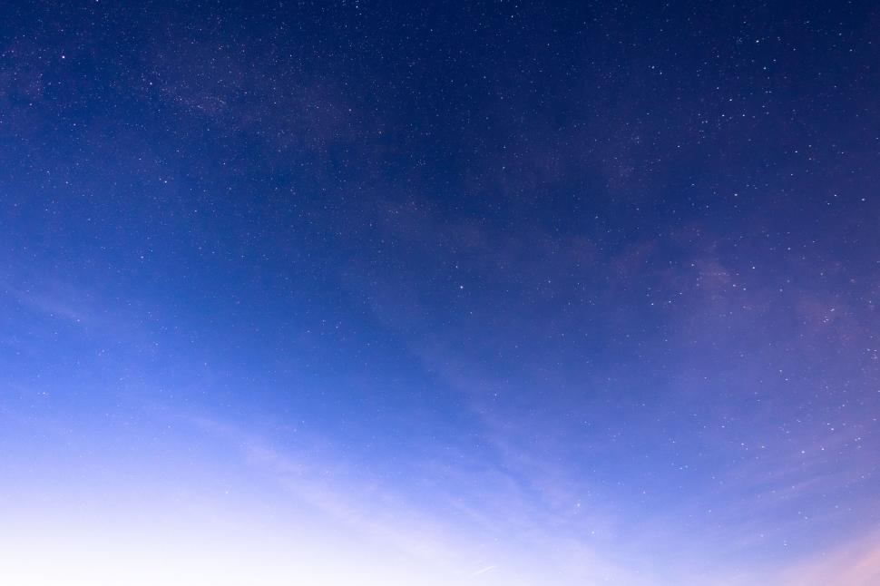 Free Image of Starry night sky with subtle cloud formation 