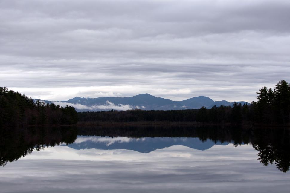 Free Image of Serene mountain lake reflection scene 