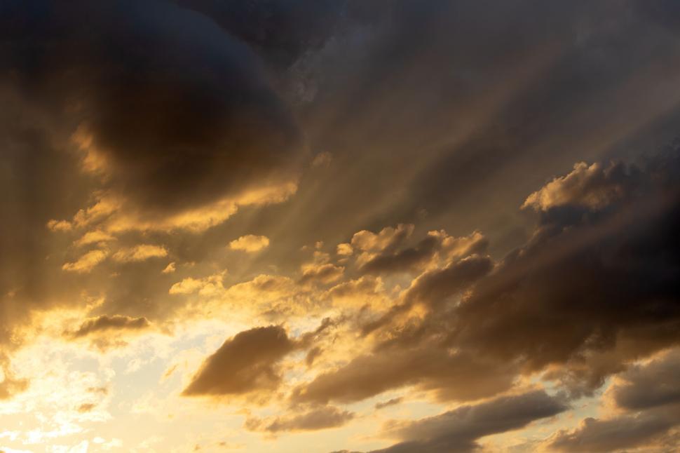 Free Image of Dramatic clouds with sunbeams through them 