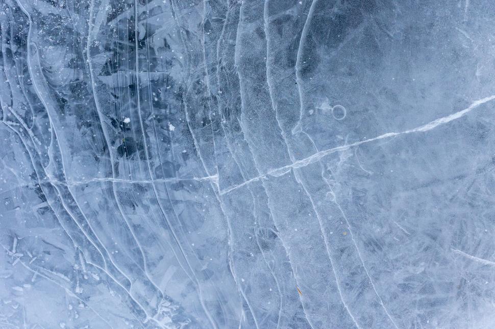 Free Image of Intricate ice patterns on a frozen surface 