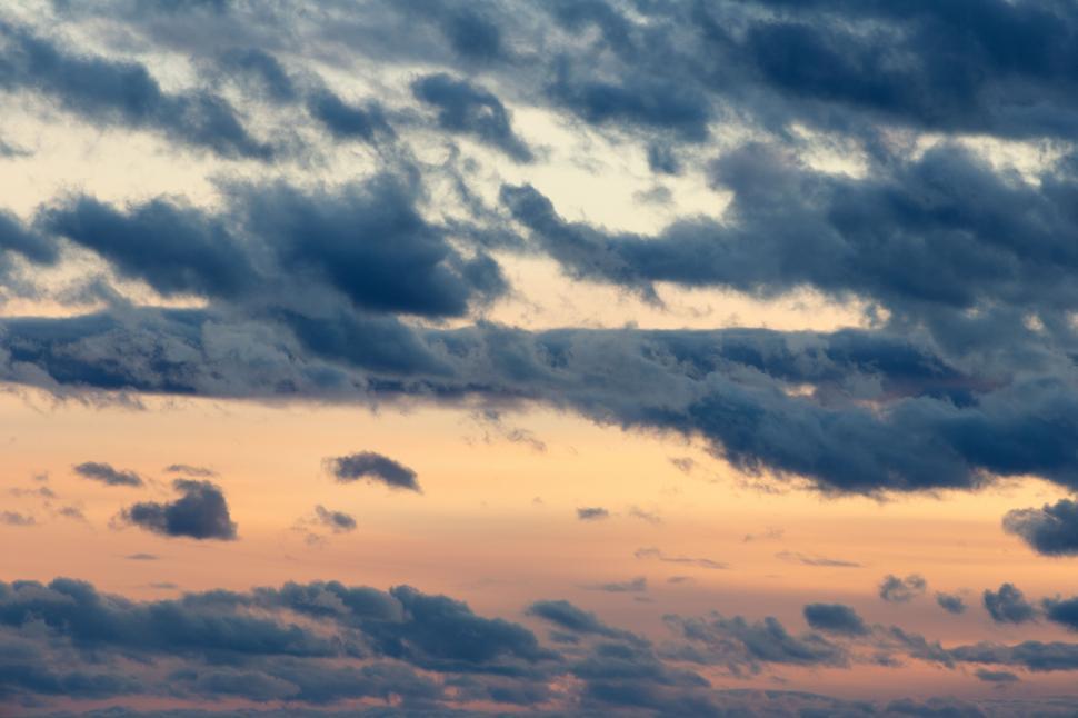 Free Image of Stunning sunset cloudscape with warm tones 