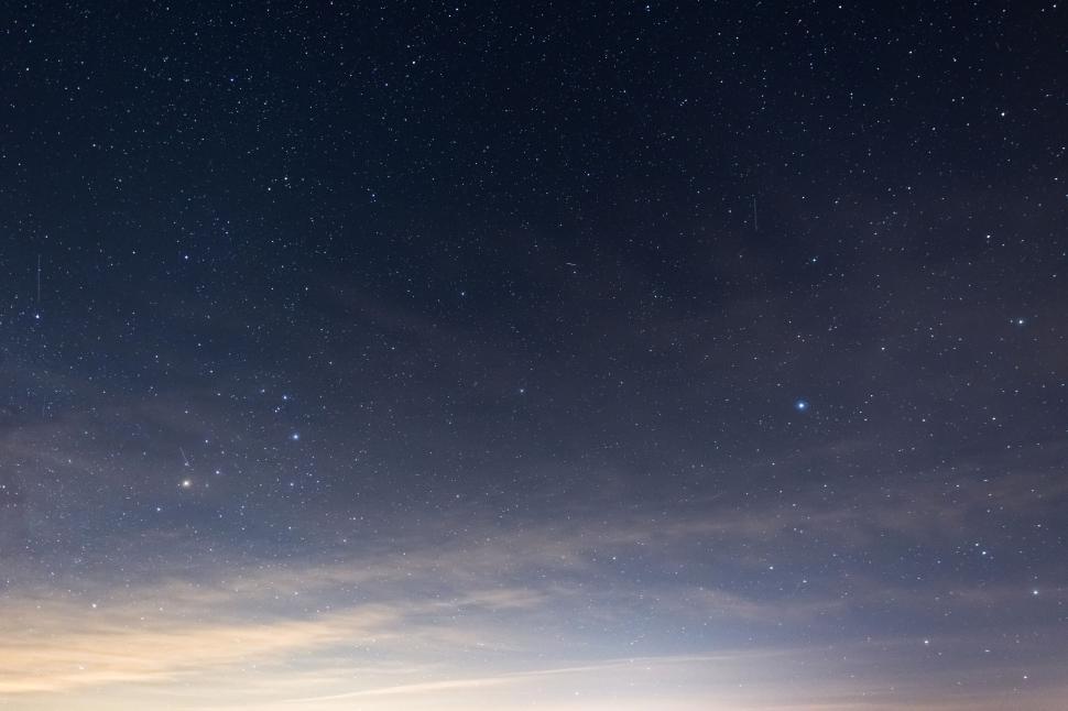 Free Image of Starry night sky with cloud whisps 