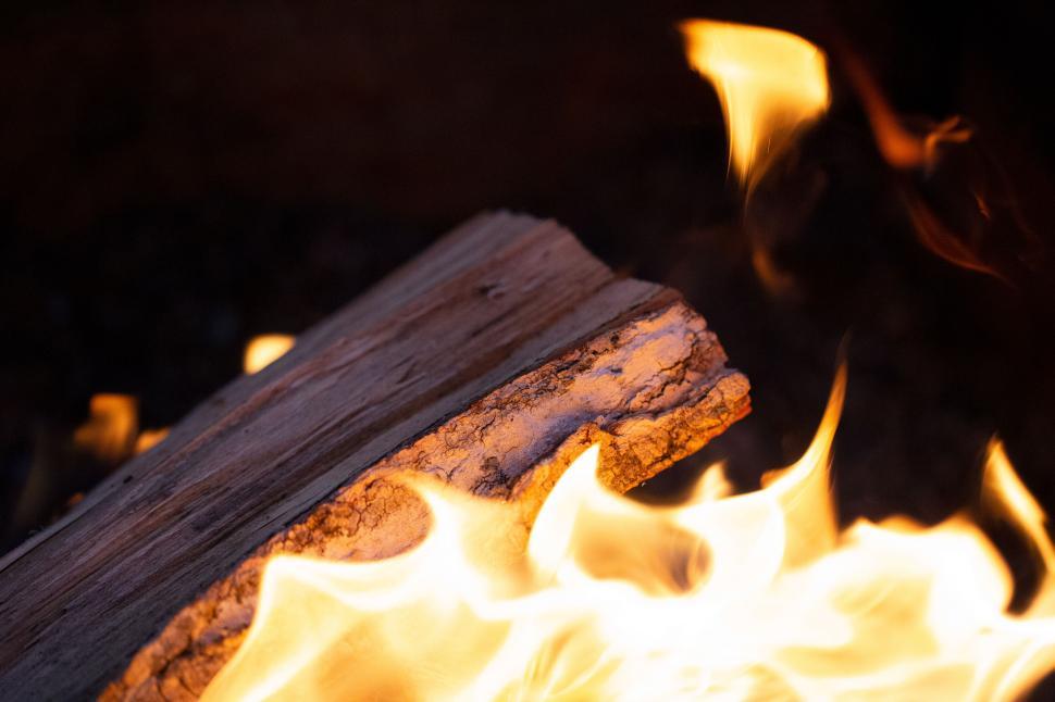 Free Image of Burning log with intense flames close-up 