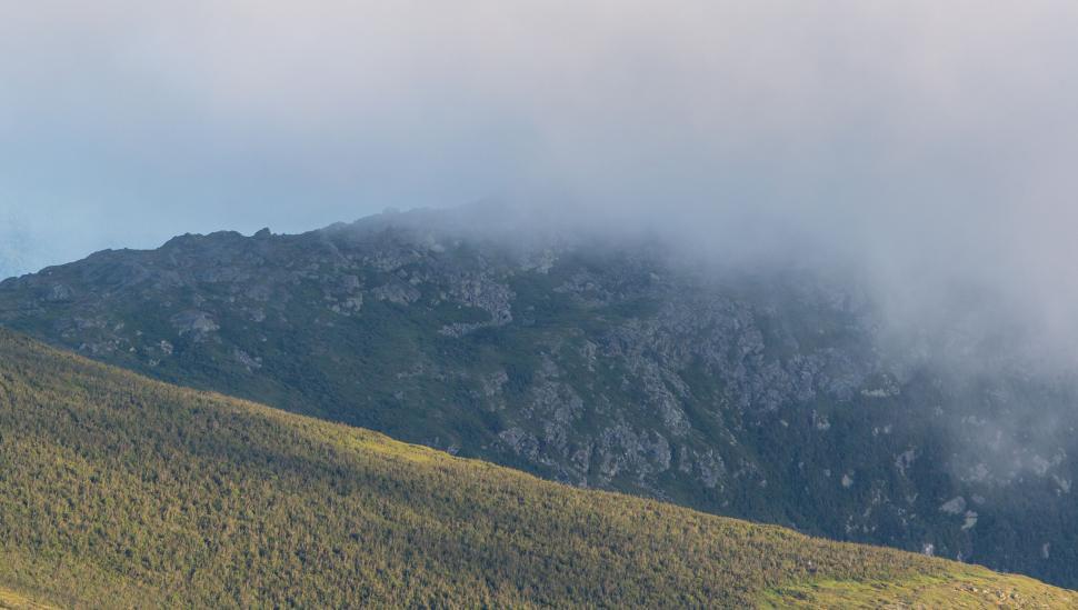 Free Image of Mountain ridge covered by cloud mist 