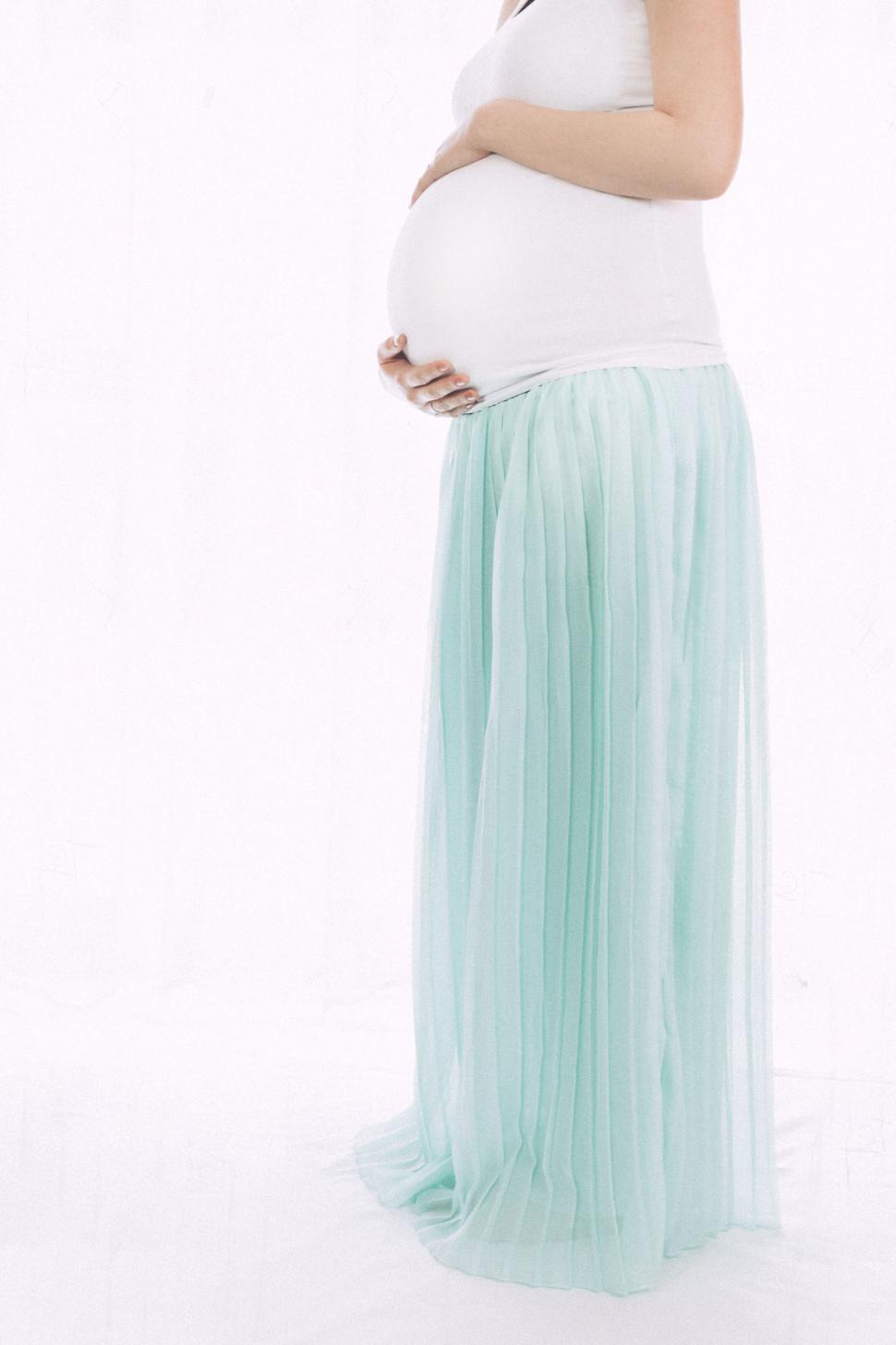 Free Image of Elegant pregnant woman in a blue dress 