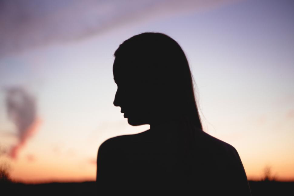 Free Image of Silhouette of a woman at sunset 