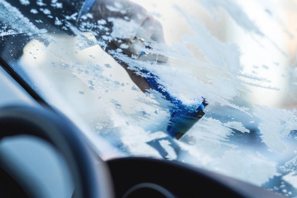 Free Image of Removing snow from car windshield 
