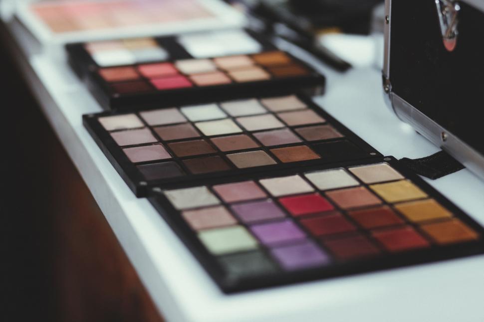 Free Image of Variety of colorful eyeshadow palettes on display 