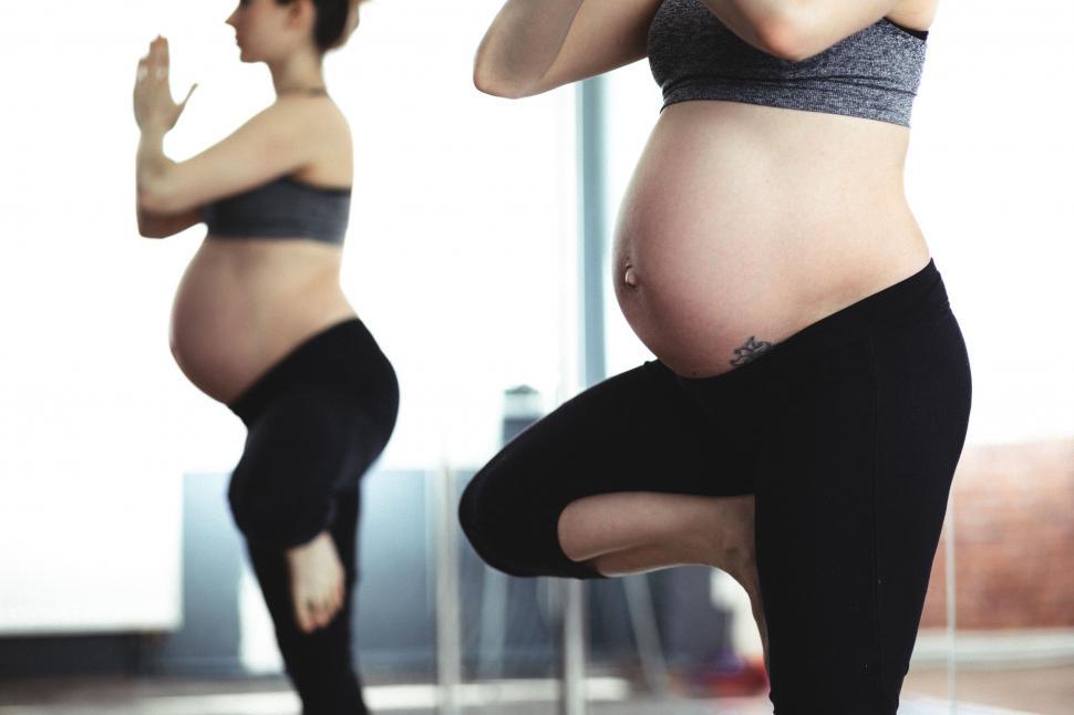 Free Image of Pregnant woman practicing yoga 