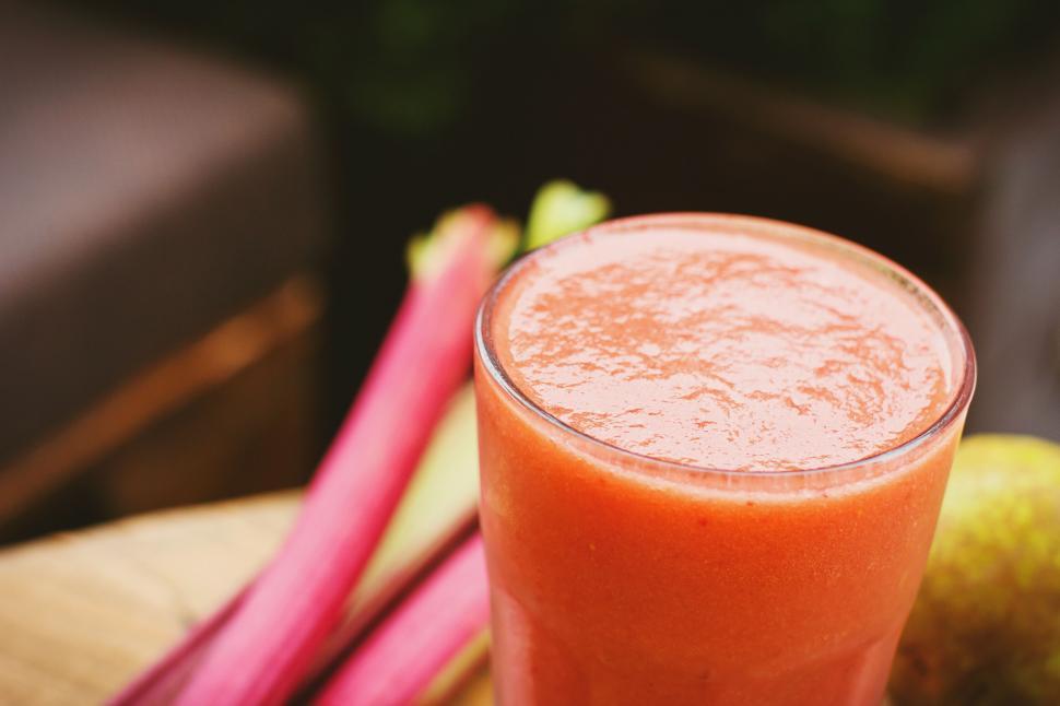 Free Image of Fresh rhubarb juice in a glass on wooden table 