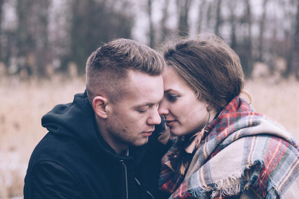 Free Image of Couple embracing tenderly in a rural field 