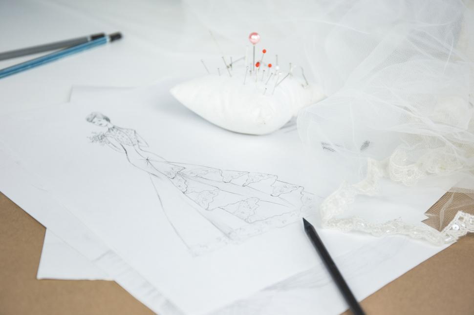 Free Image of Fashion design sketches on a desk 