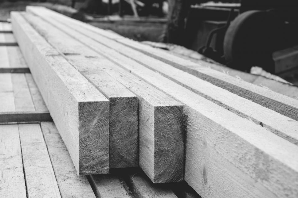 Free Image of Stacked lumber in monochrome at a sawmill 