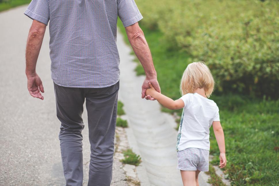 Free Image of Grandfather holding hands with grandchild 