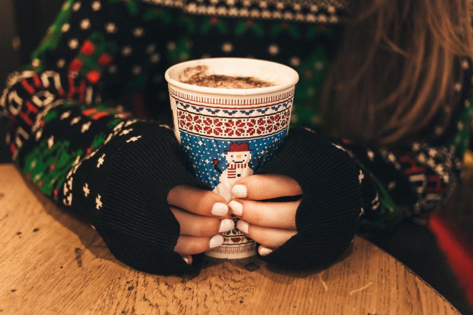 Free Image of Warm hands holding hot chocolate mug 